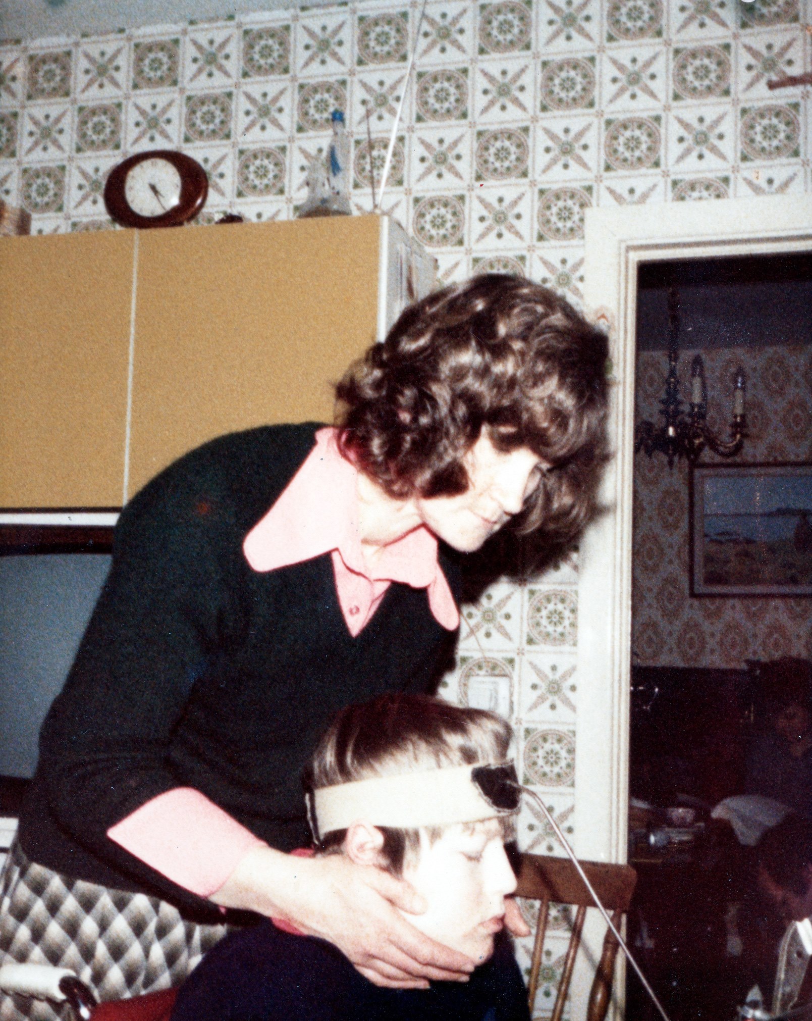 Christy Nolan wearing his unicorn stick with his mother